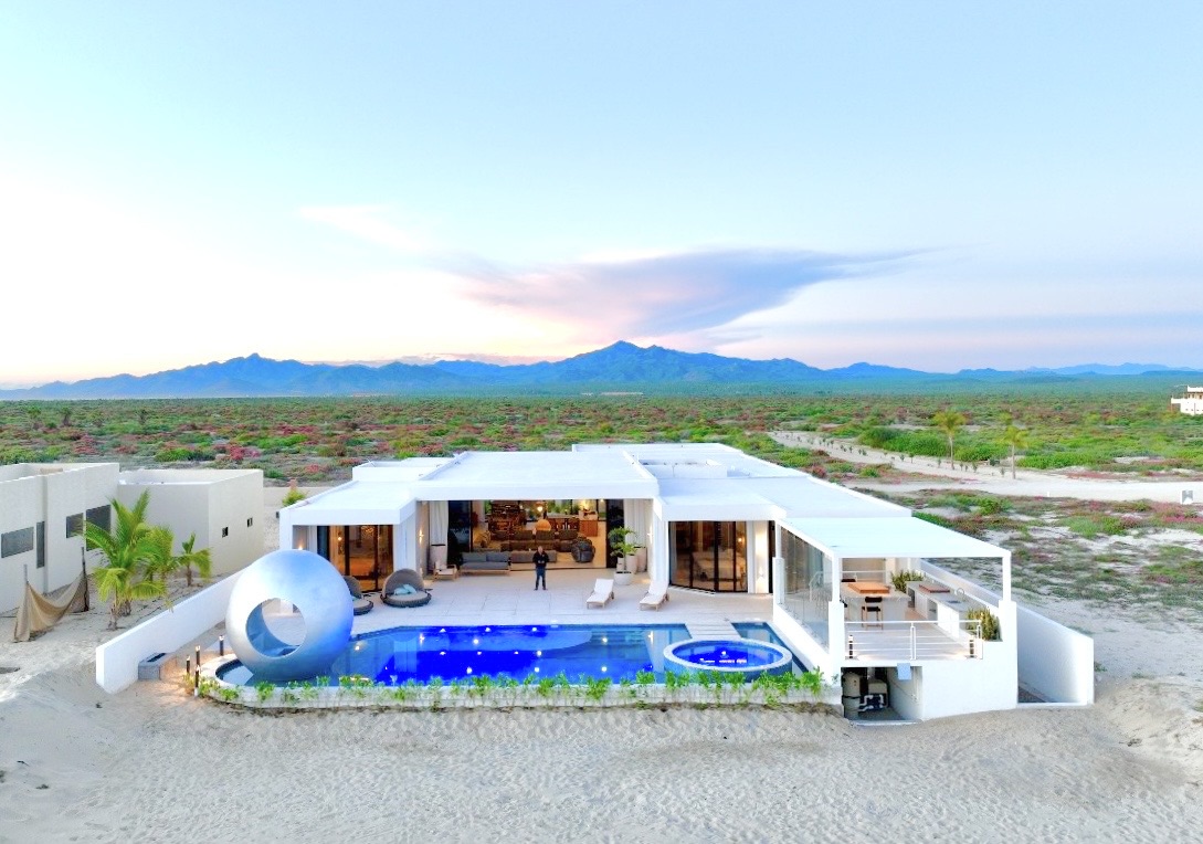 Luxury desert villa with pool and mountain view.